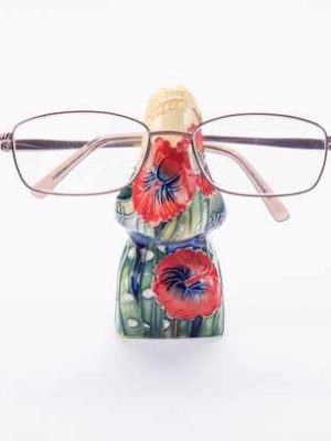 flowers hand painted on this nos shaped glasses stand red and blue colours complement each other