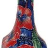small bud vase blue background and red flowers