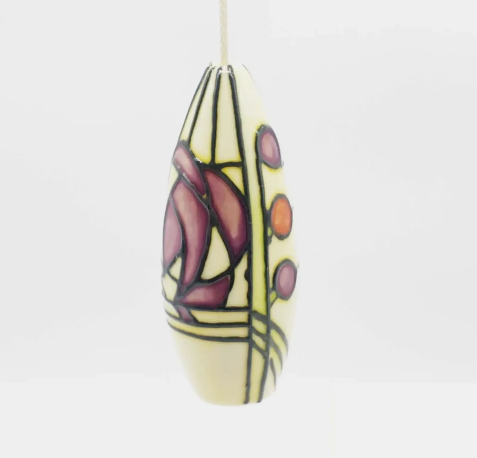 modern, art deco design purple spots flower shape on beige background light pull made from pottery tube lined
