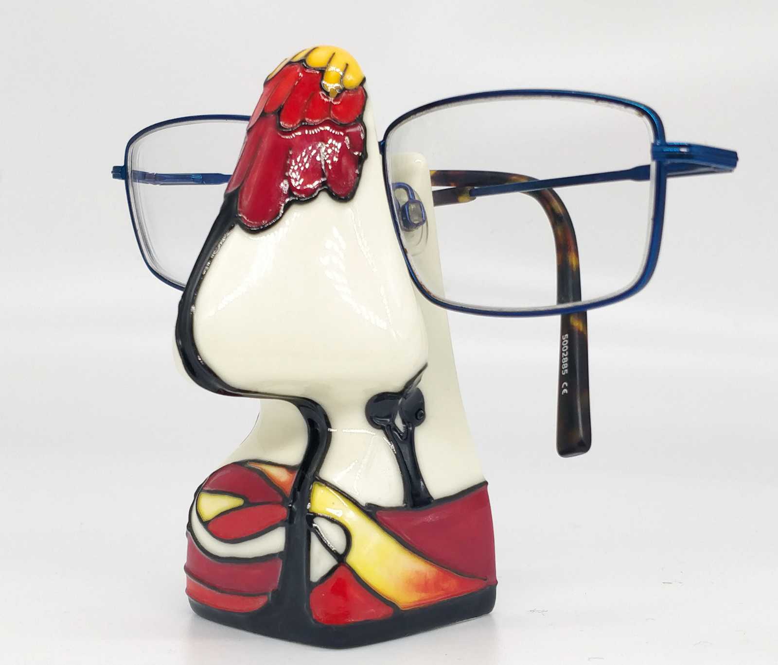 side view of noon design eyeglass holder red and white hand painted pottery