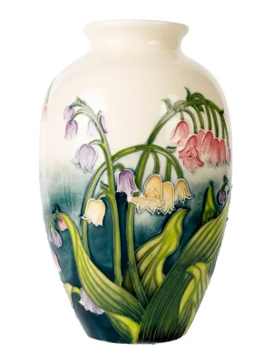base green and top cream with tube lined lily flowers rising on all sides, an elegant vase