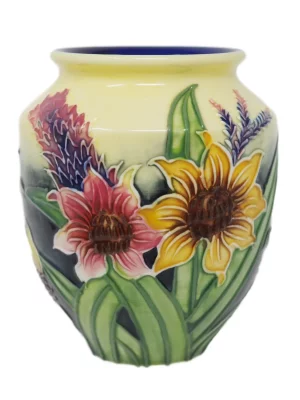 Small Round vase with yellow and red sunflowers and cream background. A stunner