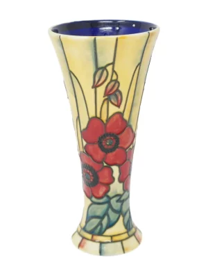 Yellow background bold red poppy pattern around this tall ceramic vase