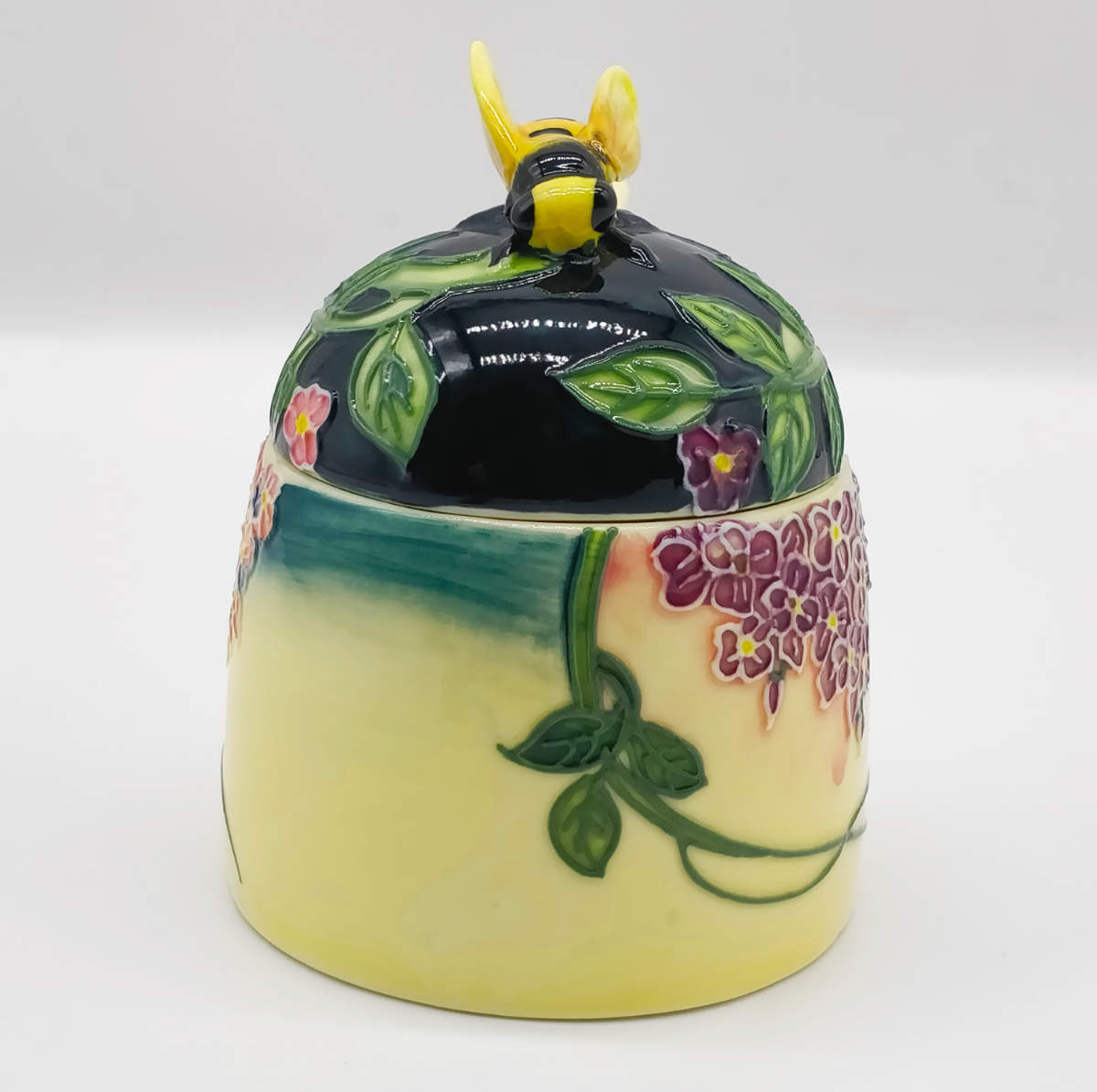 front view of the ceramic honey pot with dipper spoon by tupton ware