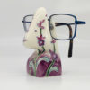 side view of the glasses stand with purple flowers covering