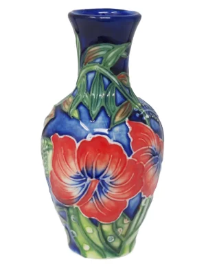 Stunning red hibiscus flower decoration and bold shades of blue contrast on this small vase