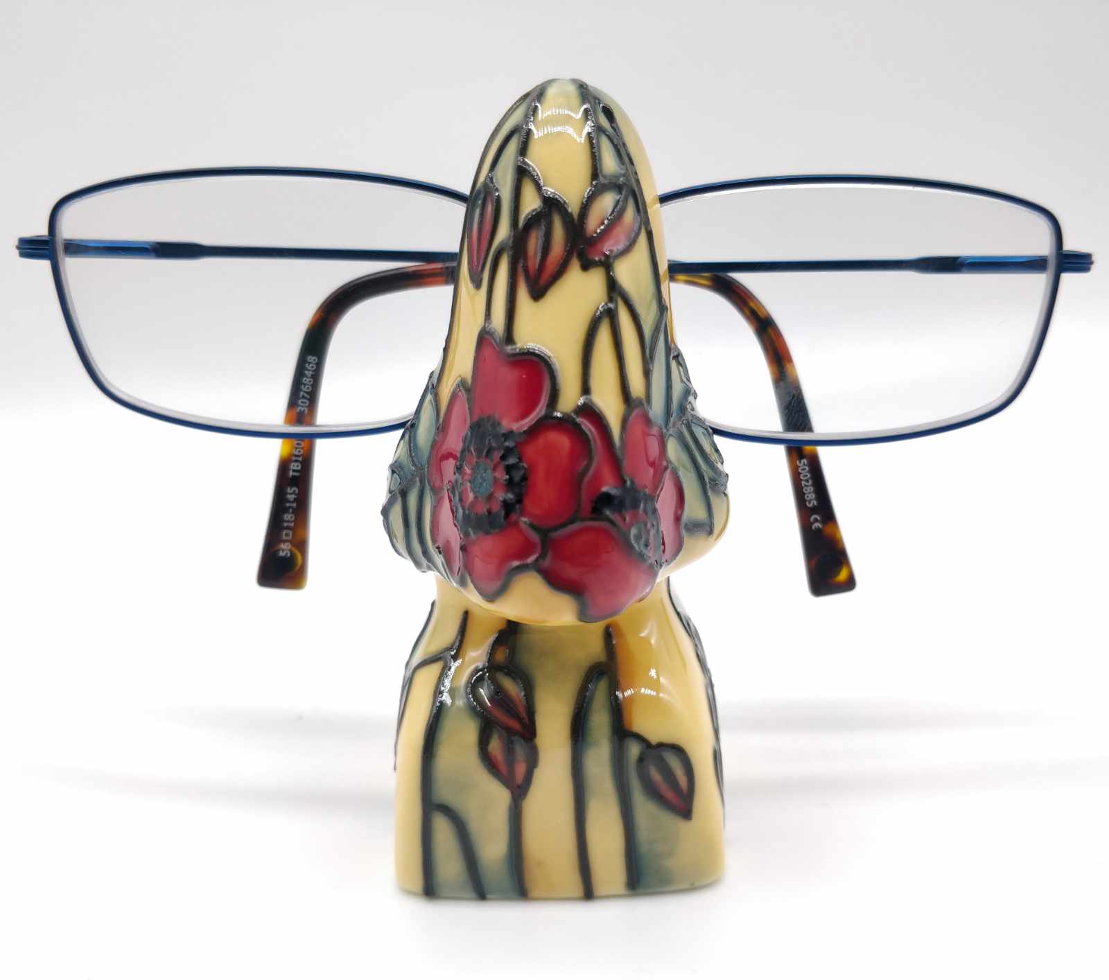 Red poppy and light yellow cream background painted on this eyeglasses holder unique