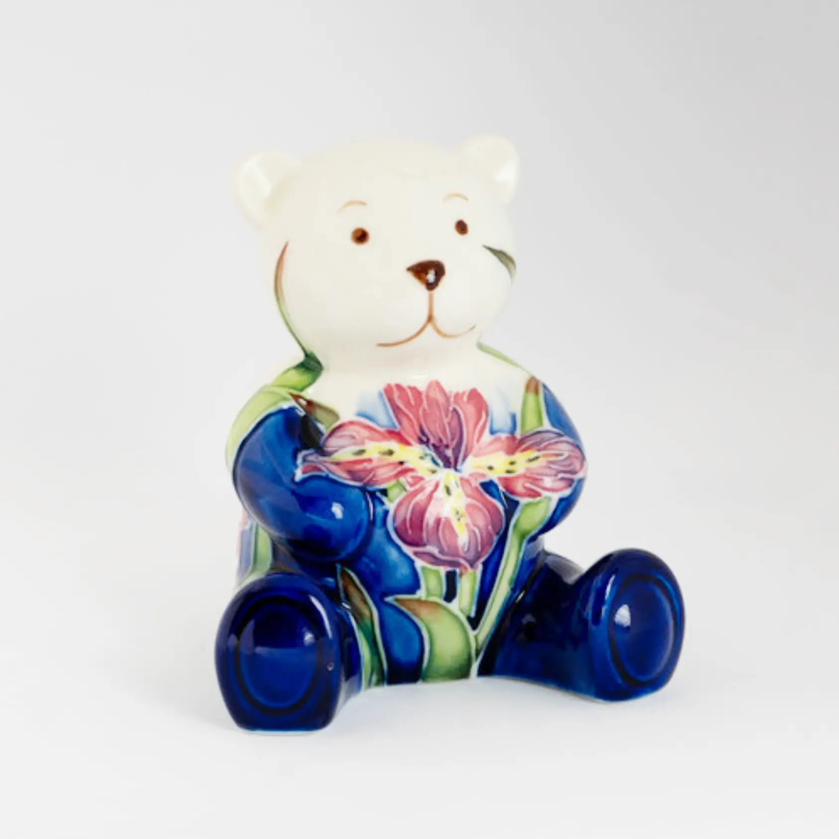 blue bear ornament with pretty floral pattern made from earthenware pottery hand painted